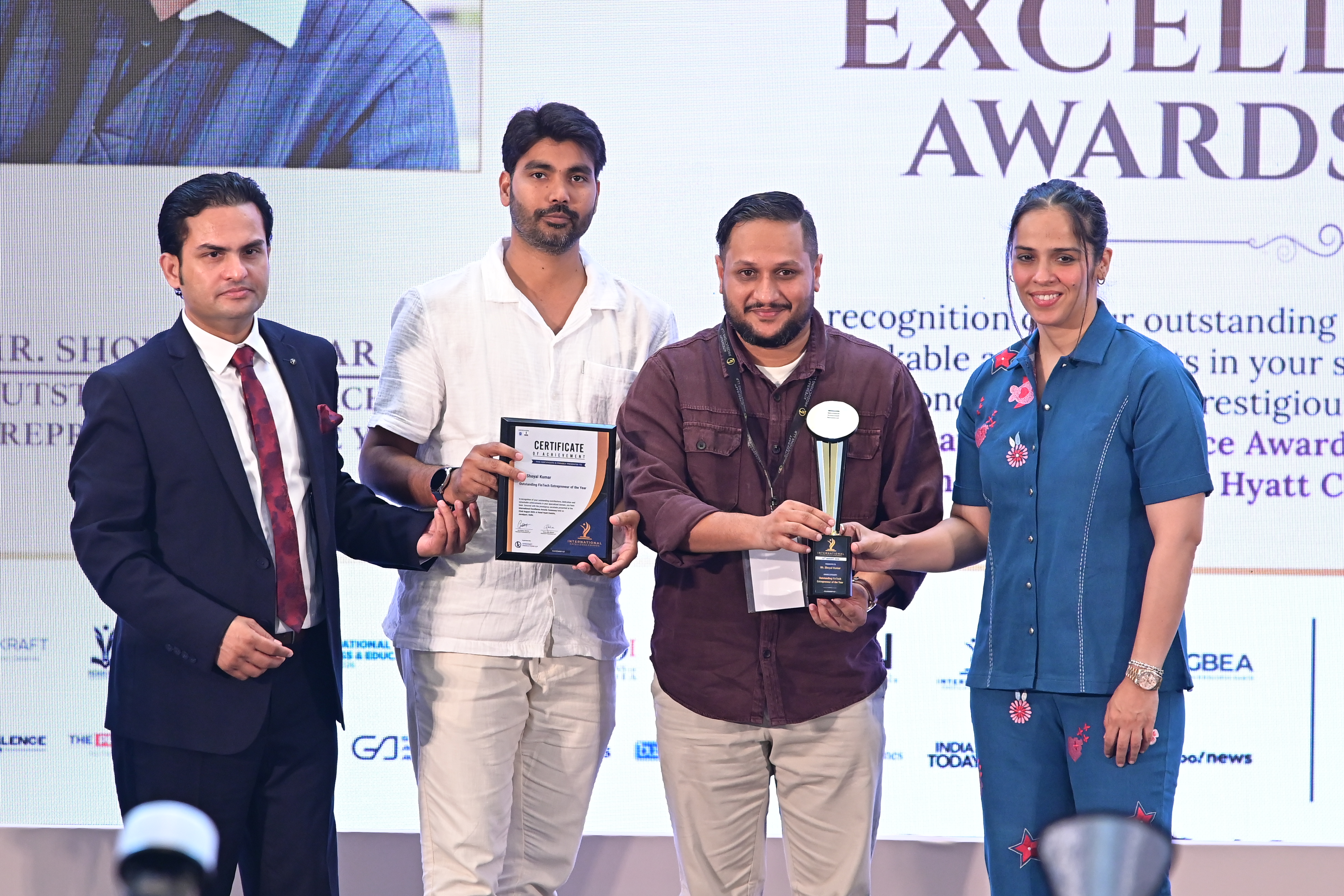 Shoyal Kumar receiving the Outstanding FinTech Entrepreneur of the Year award on stage